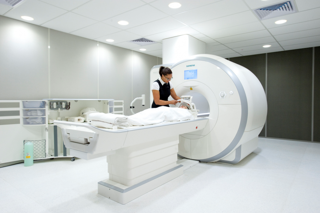 Photo of Shawna tending to a patient in an MRI